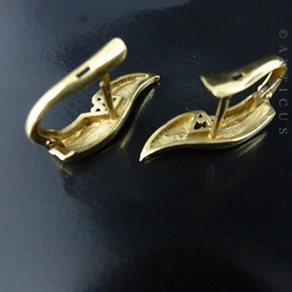 Gold and Diamond Leaf-Shaped Earrings.