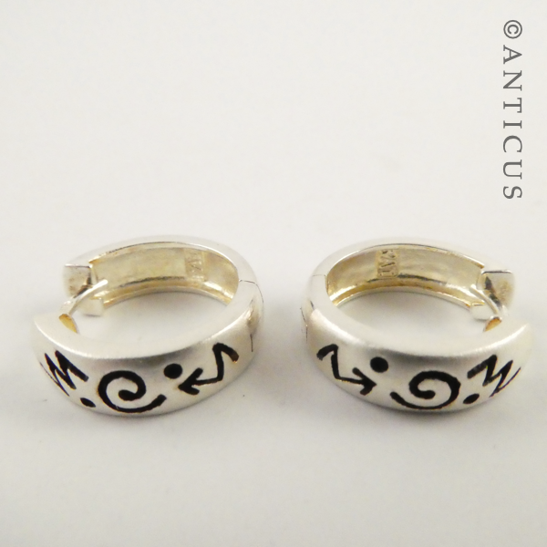 Small Silver Hoop Earrings with Abstract Design.