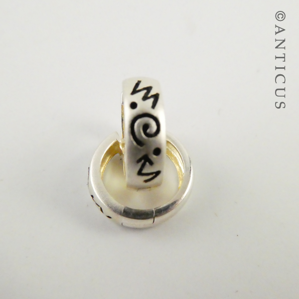 Small Silver Hoop Earrings with Abstract Design.