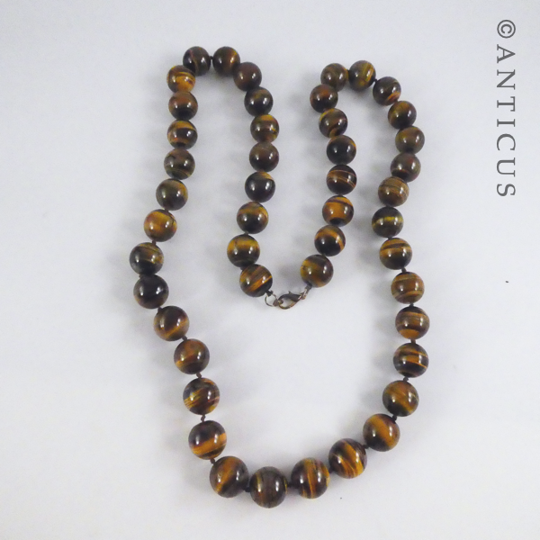 Long Strand of Large Tiger's Eye Beads, and Bracelet.