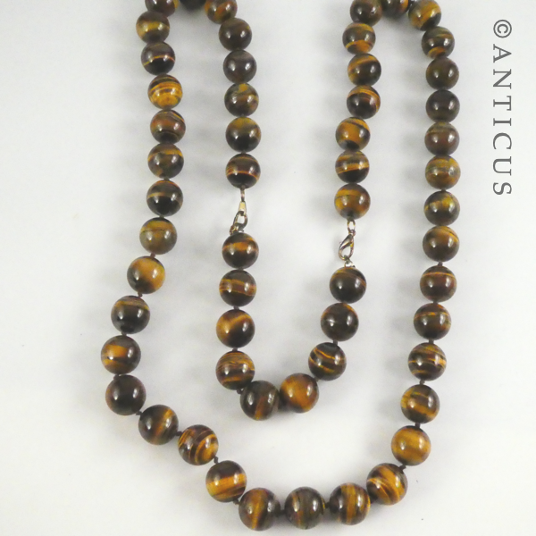 Long Strand of Large Tiger's Eye Beads, and Bracelet.