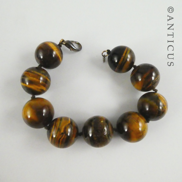 Long Strand of Large Tiger's Eye Beads, and Bracelet.
