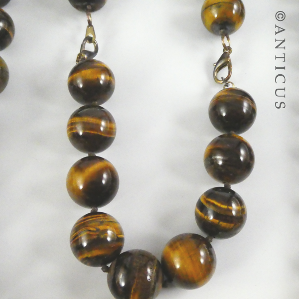 Long Strand of Large Tiger's Eye Beads, and Bracelet.