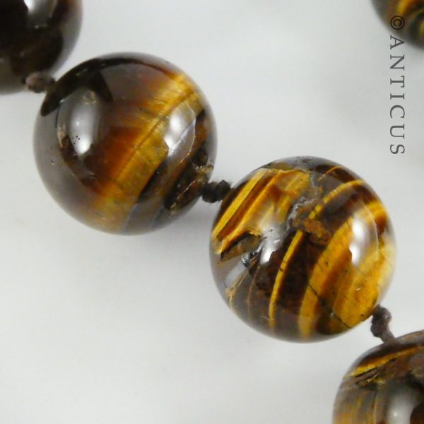 Long Strand of Large Tiger's Eye Beads, and Bracelet.