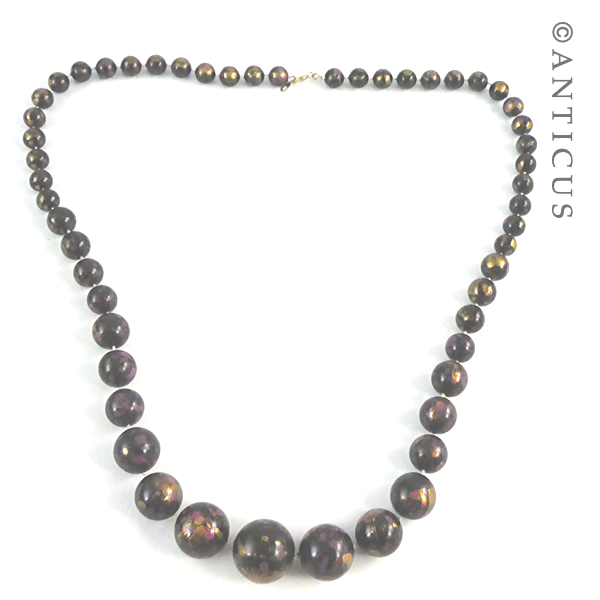 Necklace of Black, Pink, Gold Beads.