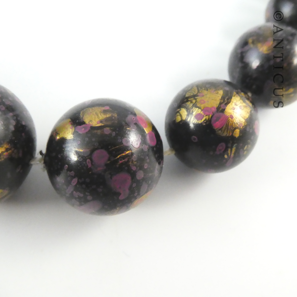Necklace of Black, Pink, Gold Beads.