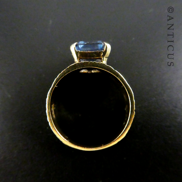 Gold and Blue Topaz Modernist Ring.