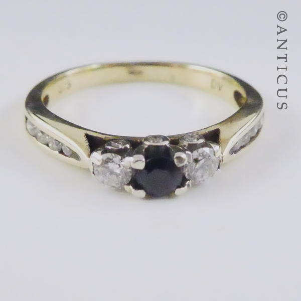 Gold, Sapphire and Diamond Ring with Side Diamonds.