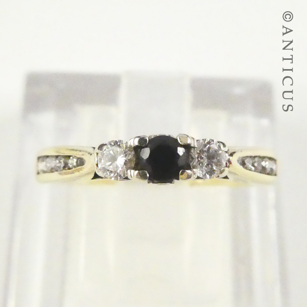 Gold, Sapphire and Diamond Ring with Side Diamonds.