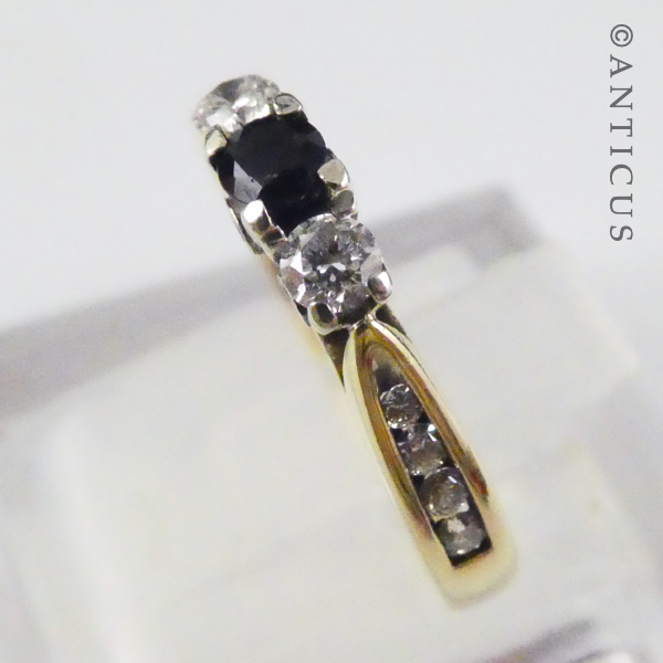 Gold, Sapphire and Diamond Ring with Side Diamonds.