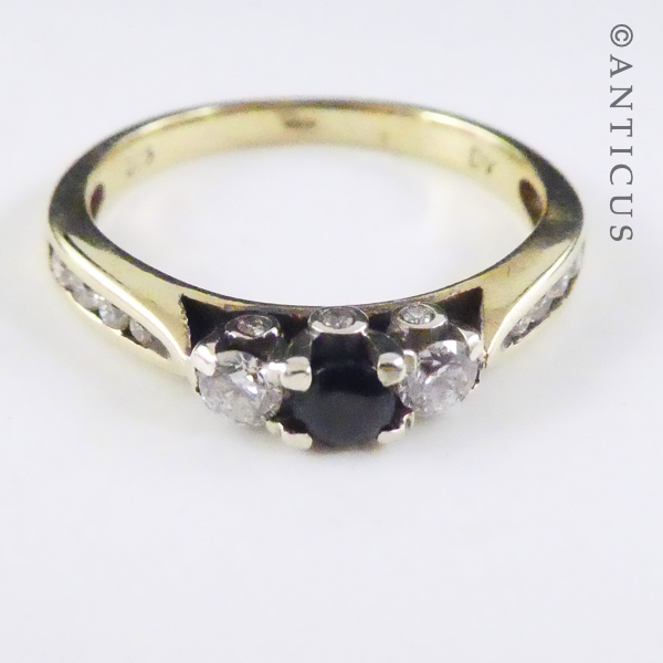 Gold, Sapphire and Diamond Ring with Side Diamonds.