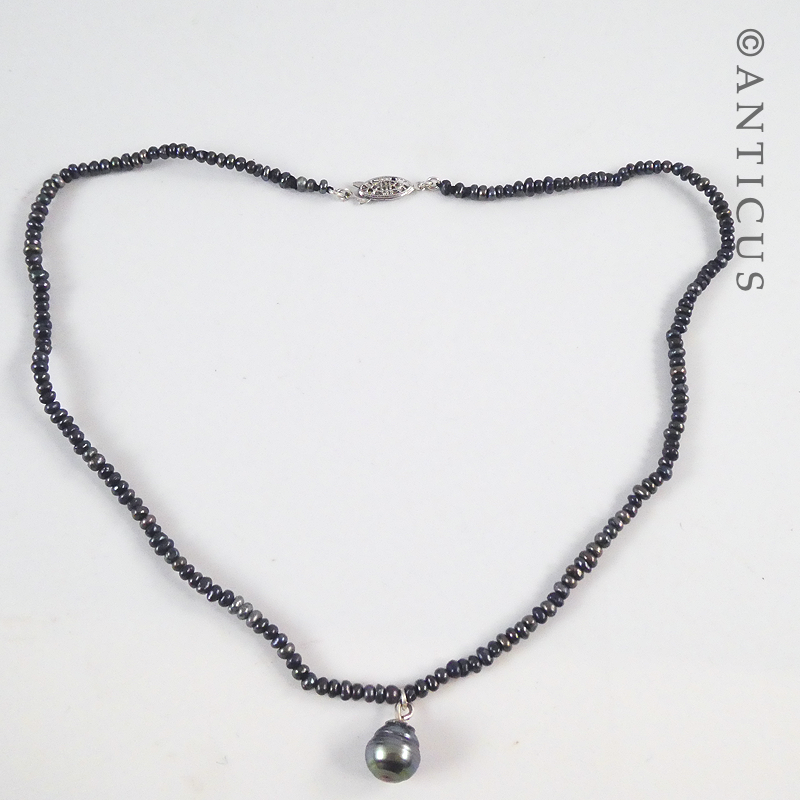 Black Pearl Pendant on Seed Pearls Necklace.