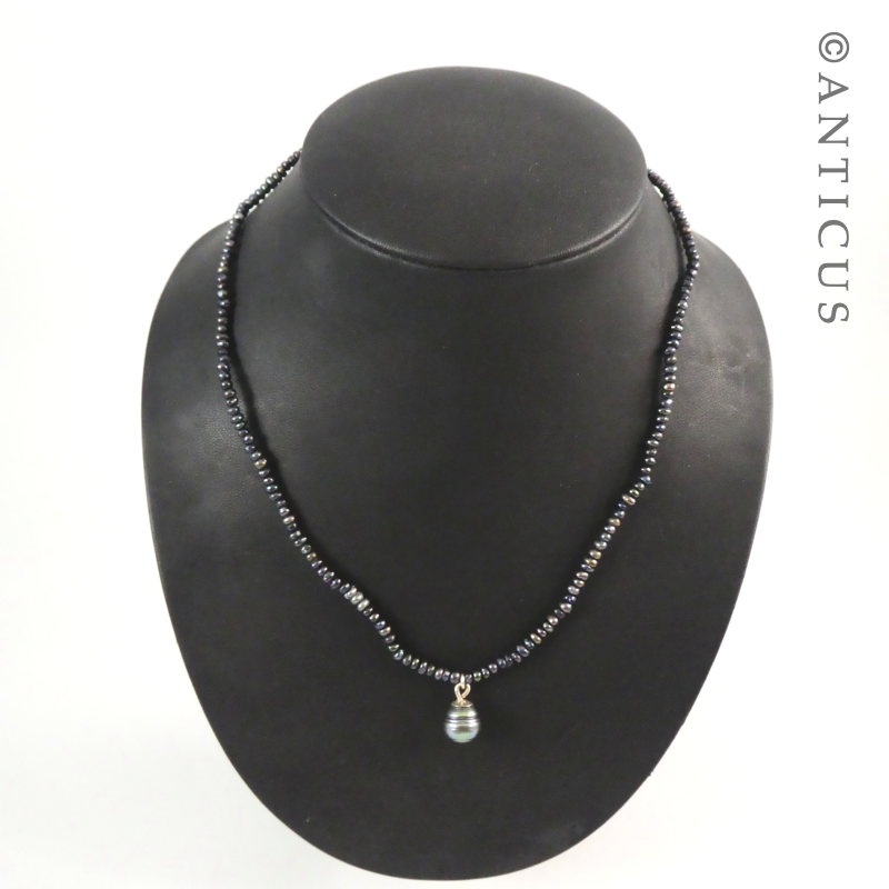Black Pearl Pendant on Seed Pearls Necklace.