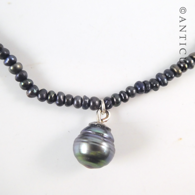 Black Pearl Pendant on Seed Pearls Necklace.