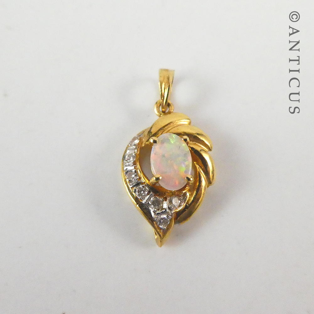 Small 18ct Gold, Opal and Diamond Pendant.