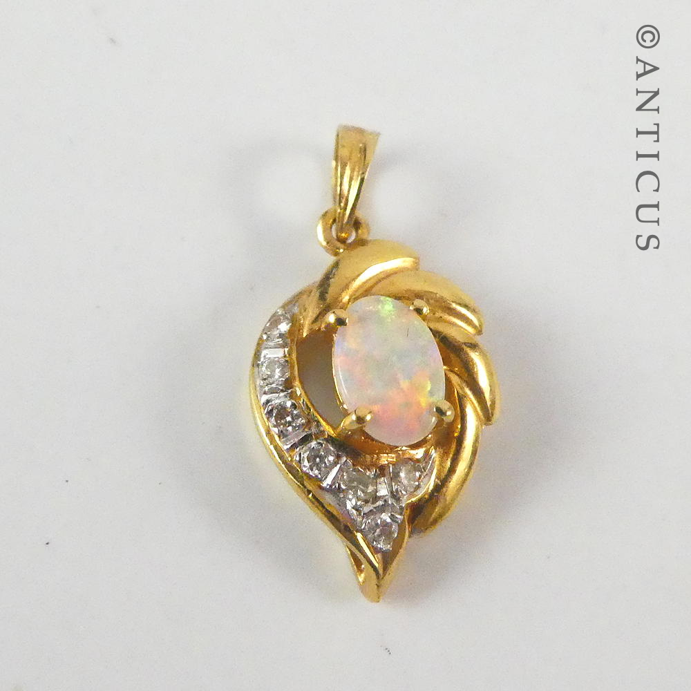 Small 18ct Gold, Opal and Diamond Pendant.