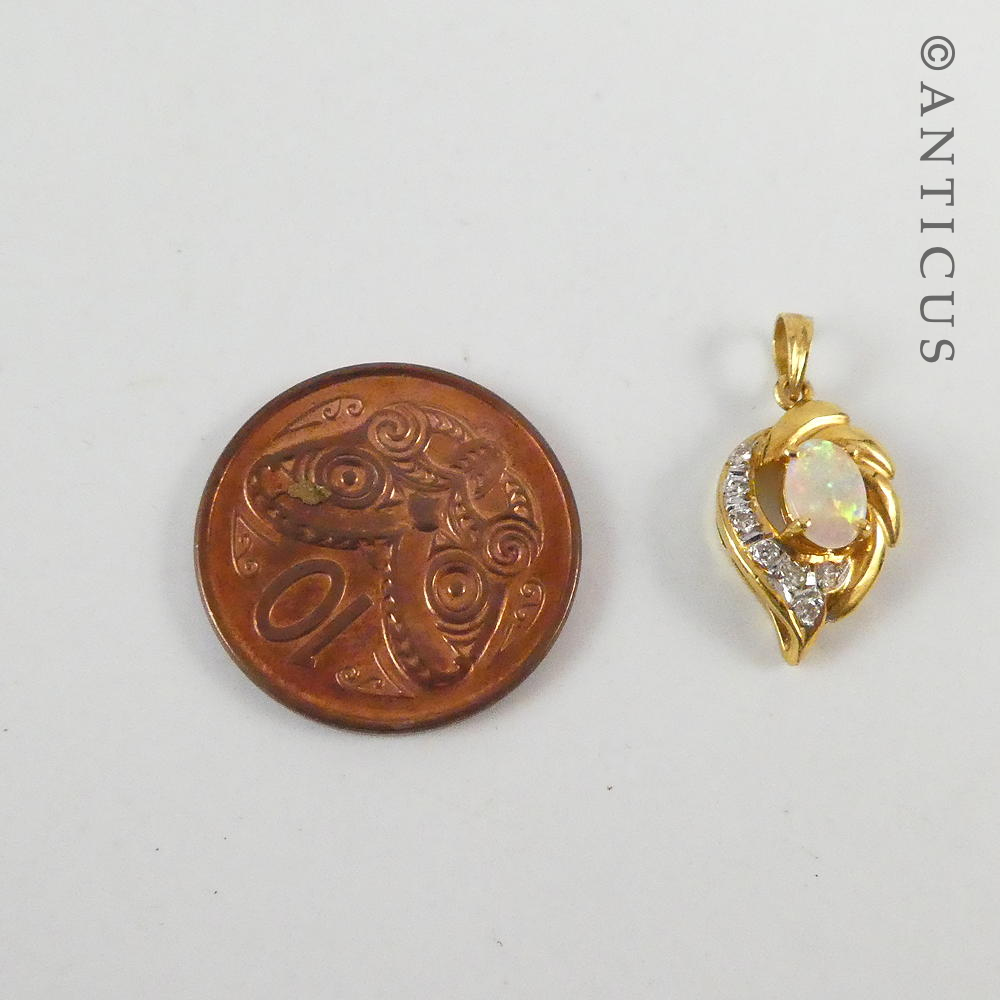 Small 18ct Gold, Opal and Diamond Pendant.
