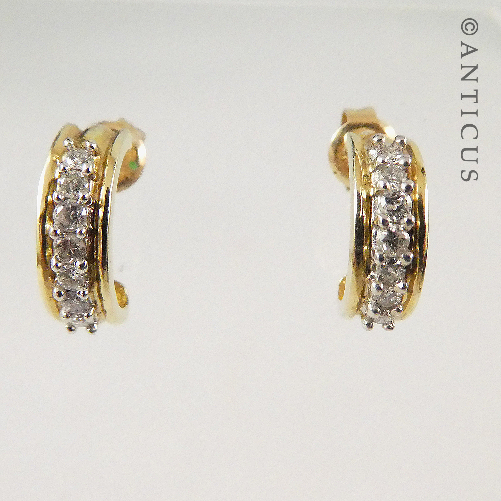 Gold and Diamond Half-Hoop Earrings.