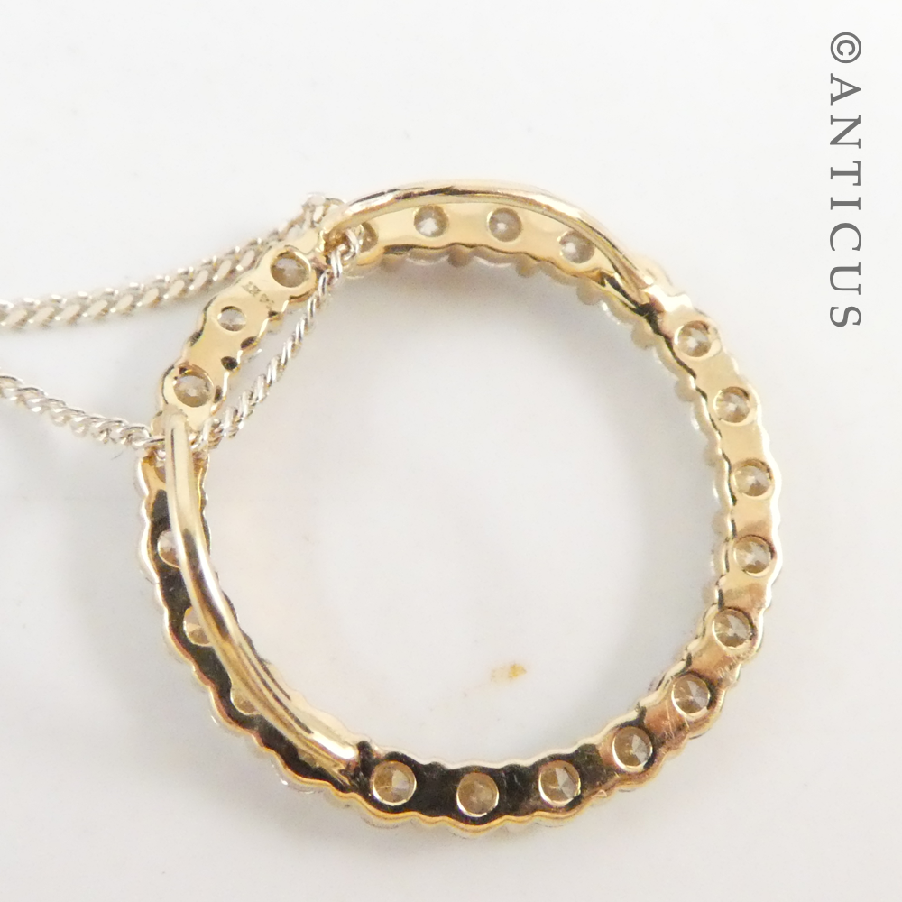 Gold and Diamond Circular Pendant on Chain.