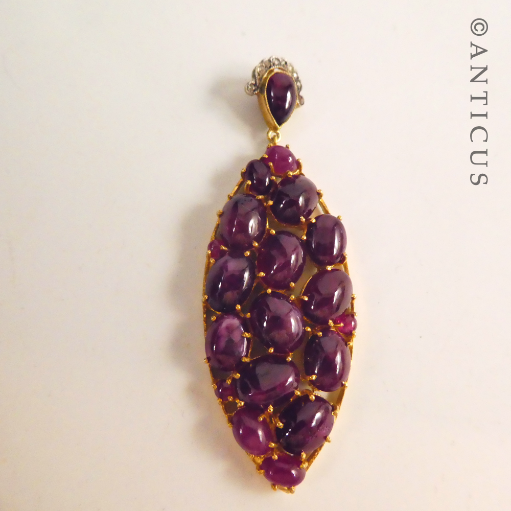 Antique-Style Pendant with Cabochon Rubies and Diamonds.