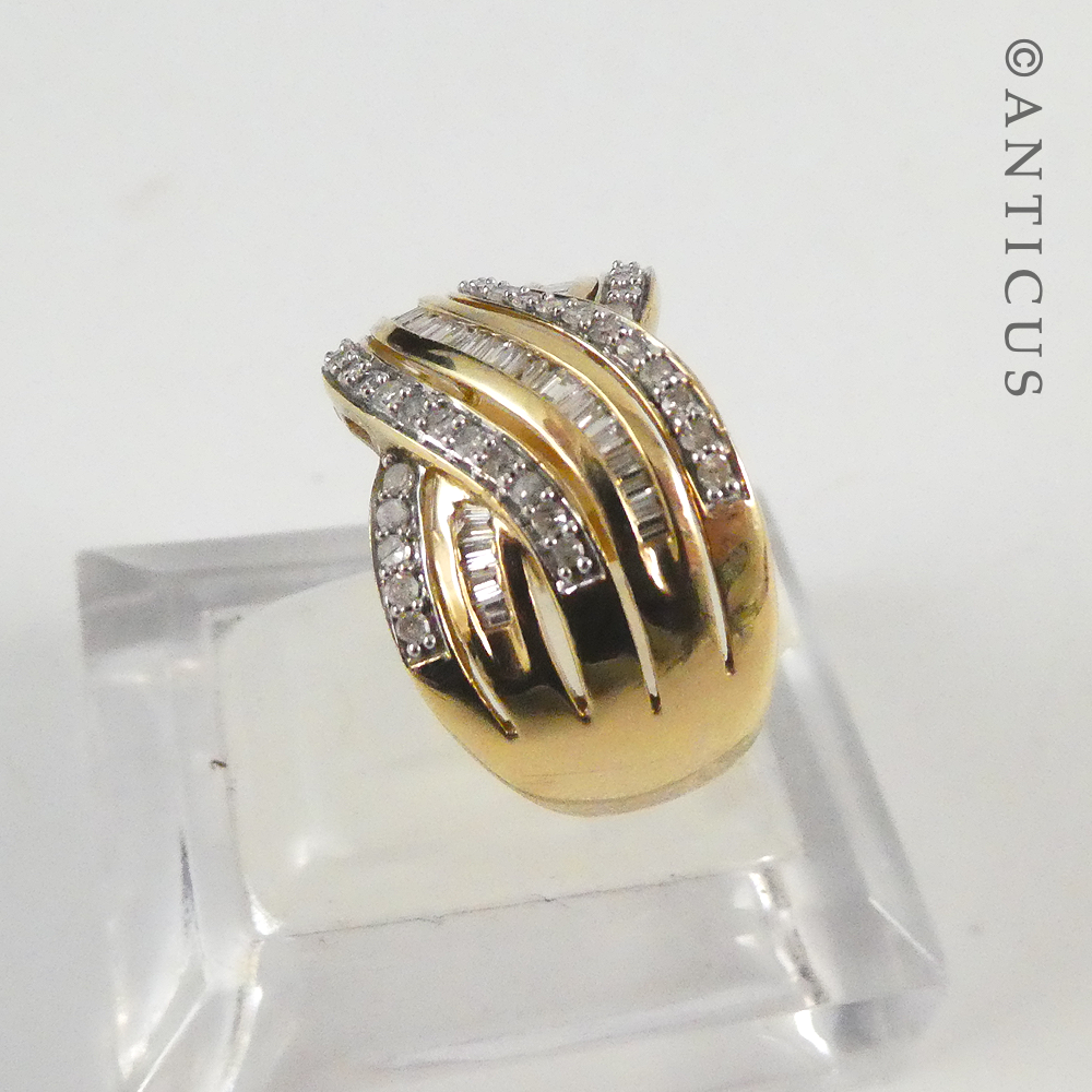 Gold and Diamond Wide Cross-Over Ring.