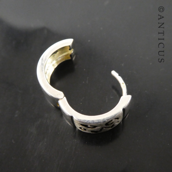 Small Silver Hoop Earrings with Abstract Design.