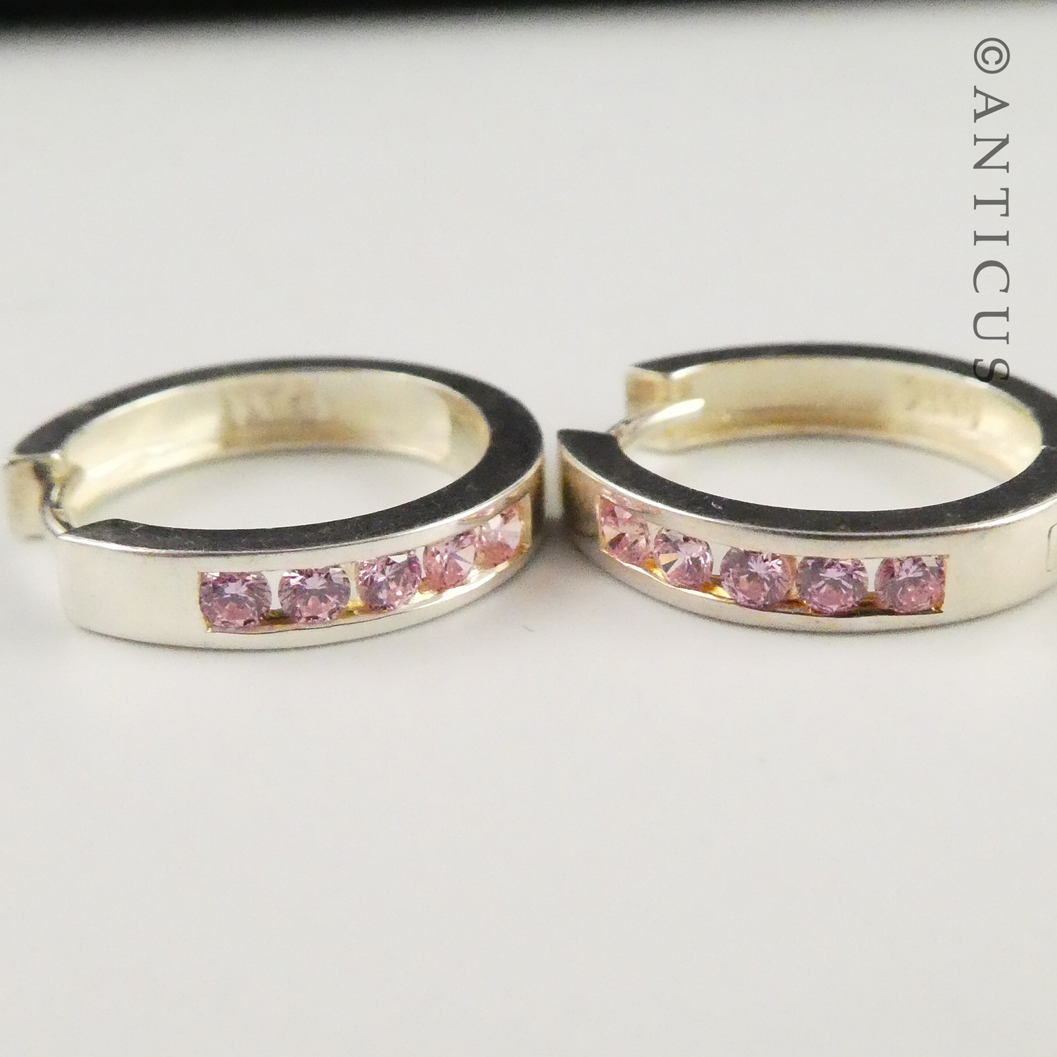Silver Hoop Earrings with Inset Pink CZs.