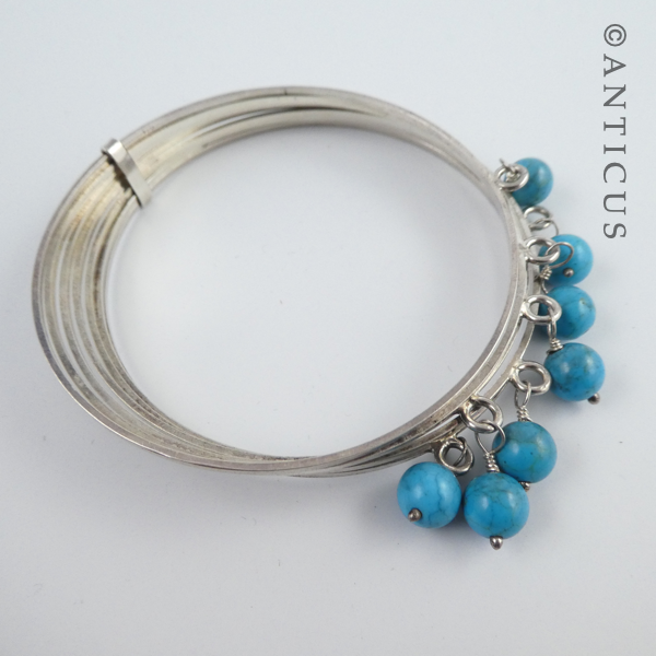 Silver Multi Bangles with Turquoise Beads.