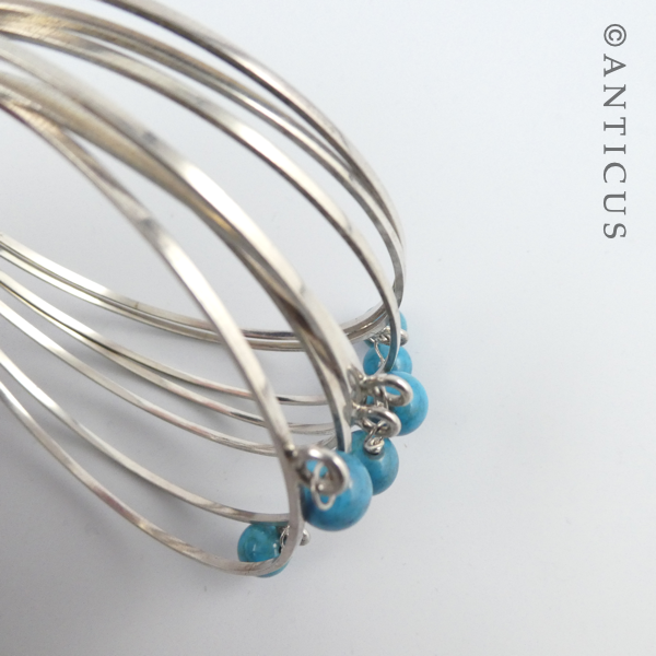 Silver Multi Bangles with Turquoise Beads.