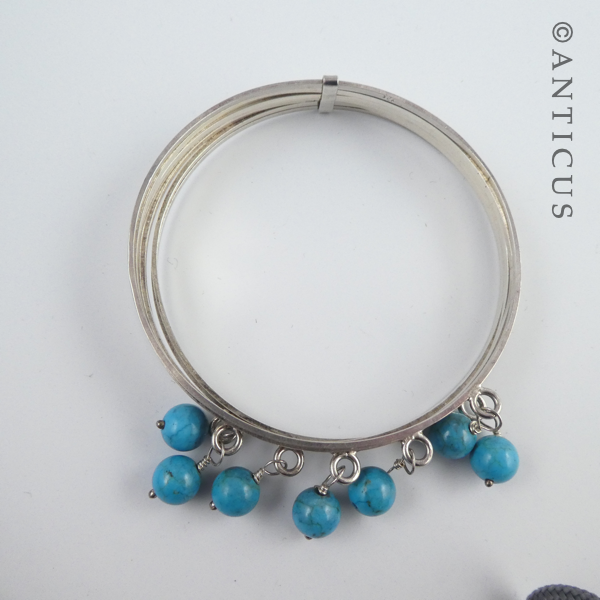 Silver Multi Bangles with Turquoise Beads.