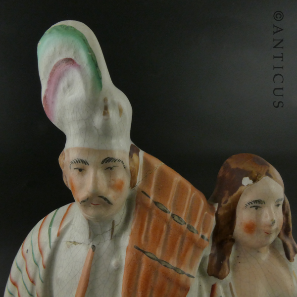 Staffordshire Flat Back Figurine of Highland Couple.