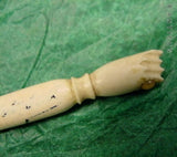 Carved Bone Fist Handle, containing Stanhope.
