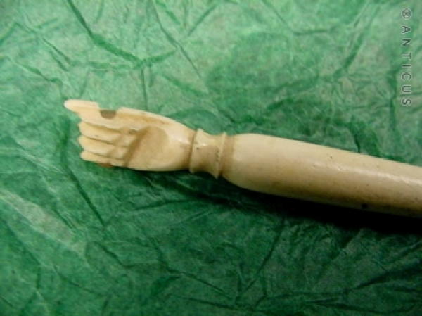 Carved Bone Fist Handle, containing Stanhope.