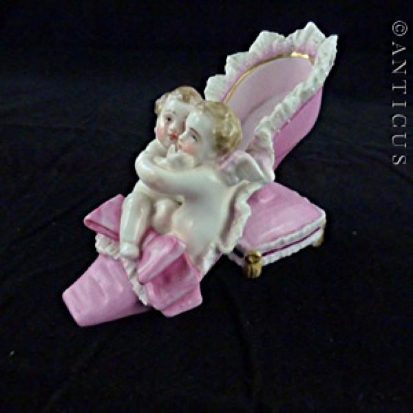 19th Century Porcelain Shoe and Cherubs Ornament.
