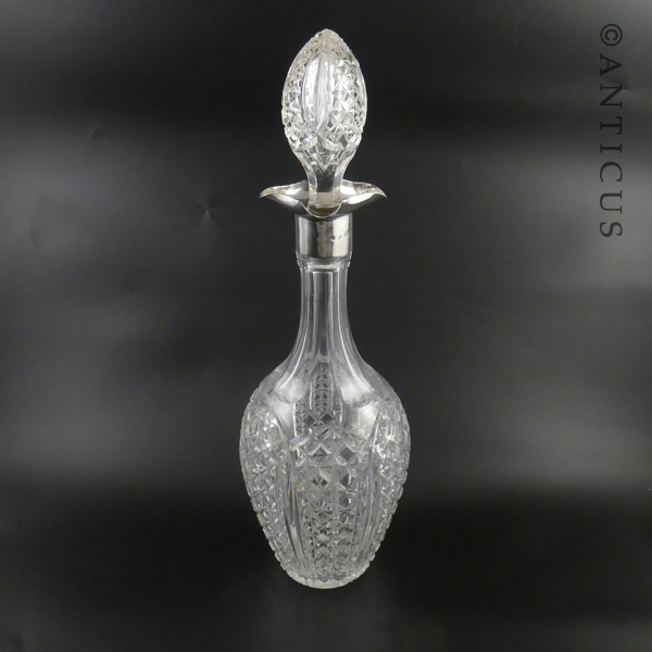 Large Heavy Crystal Decanter with Silver Neck.