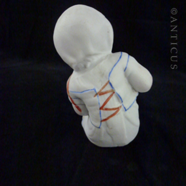 Bisque Victorian Piano Baby.