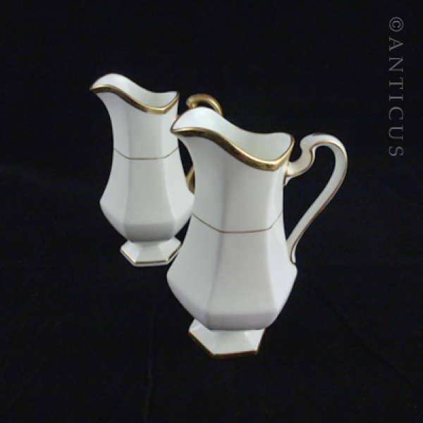 Pair of Minton Gold and White Jugs.