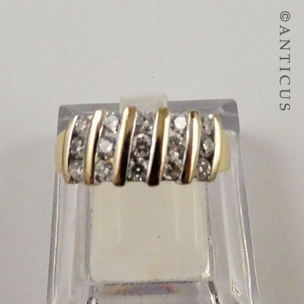18ct Gold and Channel-Set Diamond Ring.