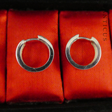 Tiny Pair of Silver Hoop Earrings.