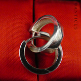 Tiny Pair of Silver Hoop Earrings.