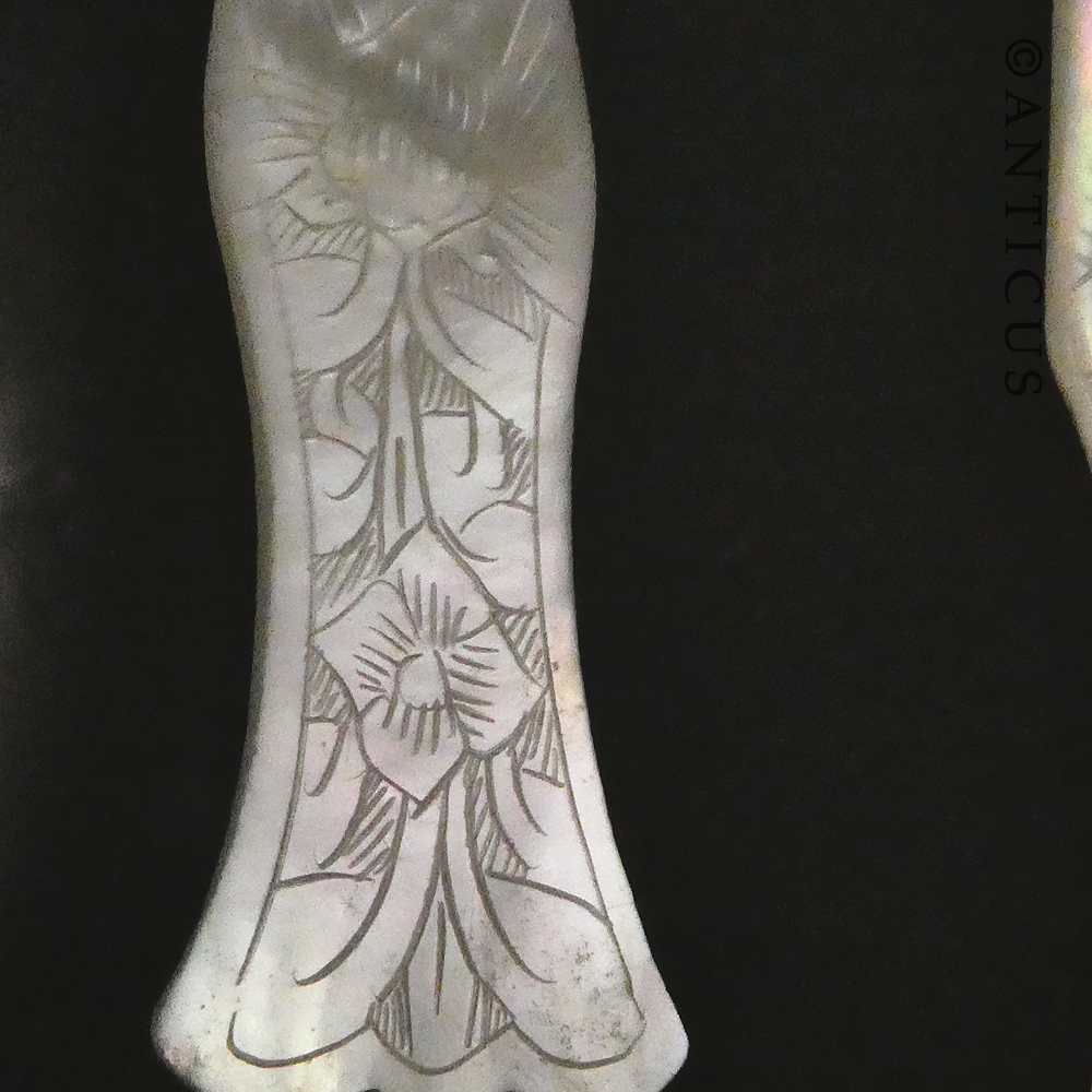 Three Mother of Pearl Spoons.