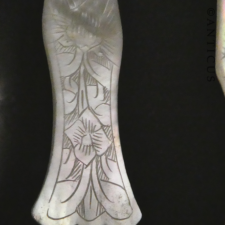 Three Mother of Pearl Spoons.