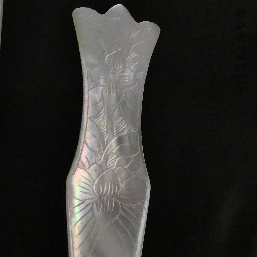 Three Mother of Pearl Spoons.
