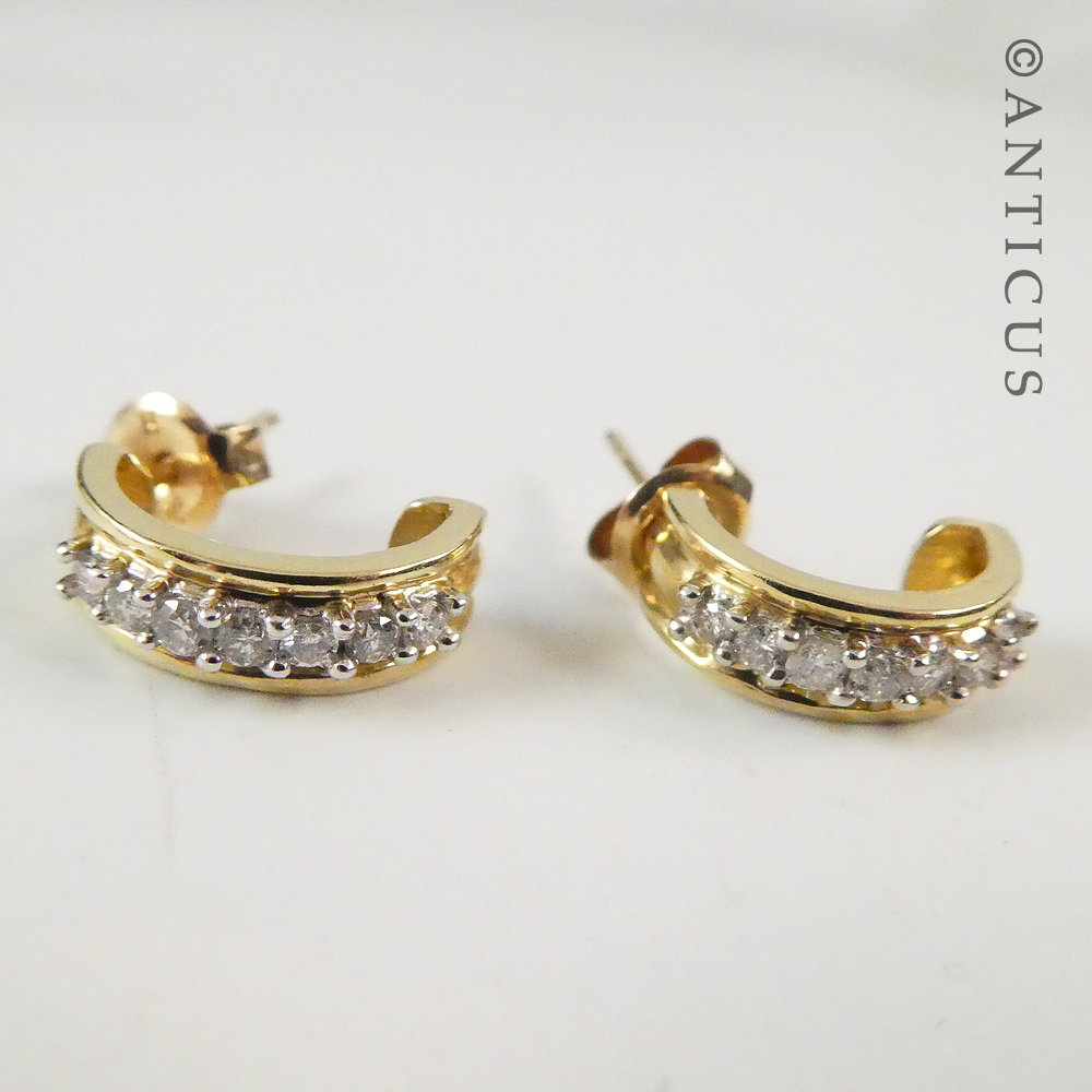 Gold and Diamond Half-Hoop Earrings.