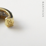 Gold and Diamond Half-Hoop Earrings.