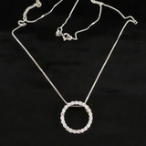 Gold and Diamond Circular Pendant on Chain.