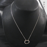 Gold and Diamond Circular Pendant on Chain.