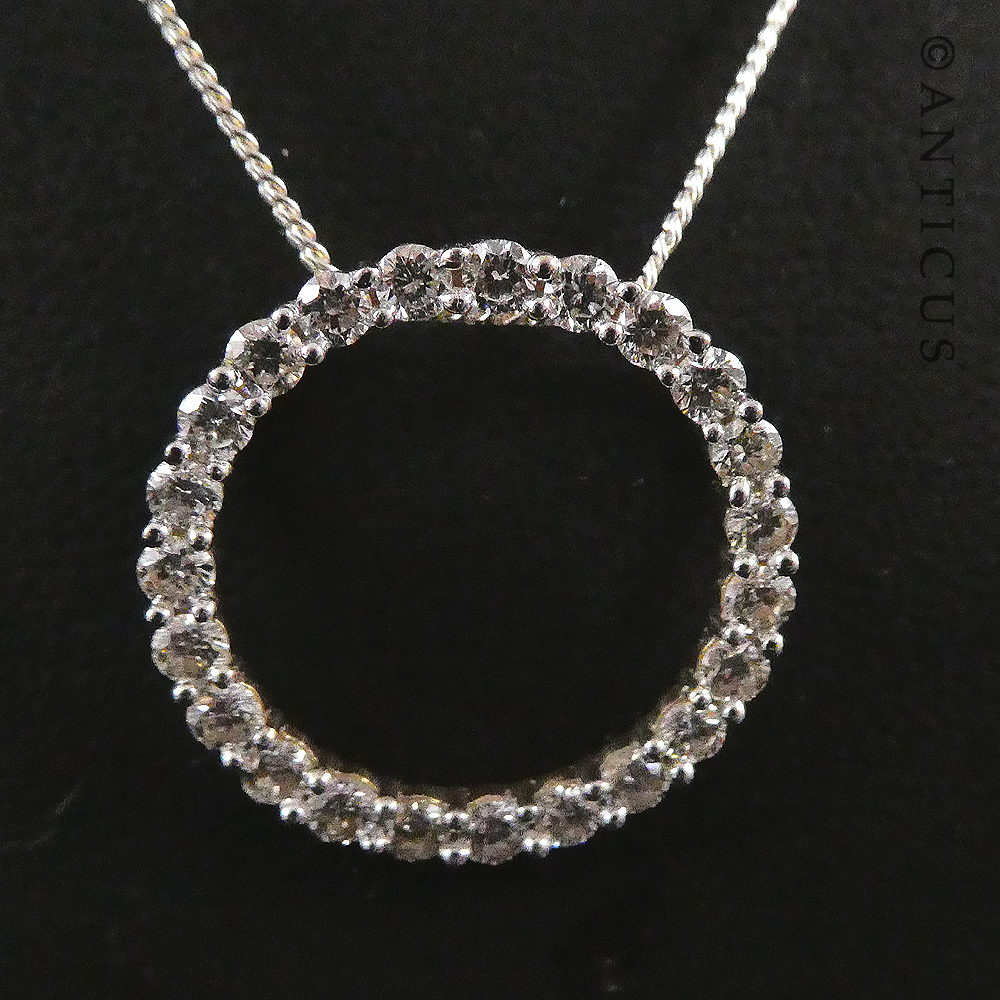 Gold and Diamond Circular Pendant on Chain.