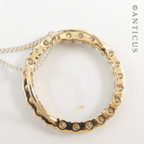 Gold and Diamond Circular Pendant on Chain.