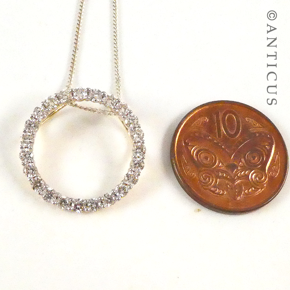 Gold and Diamond Circular Pendant on Chain.